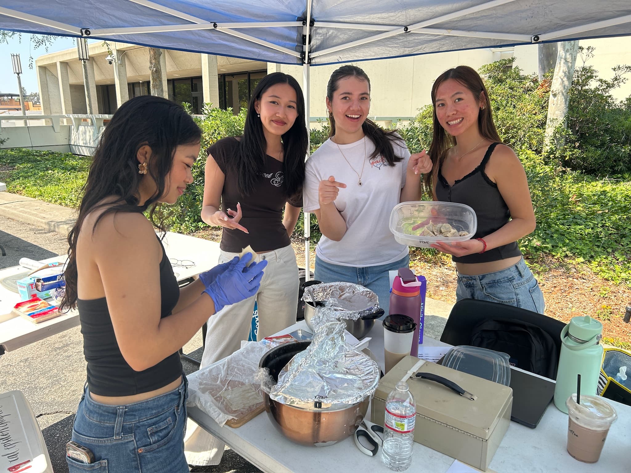 PACT members running a fundraiser booth on Ring Road